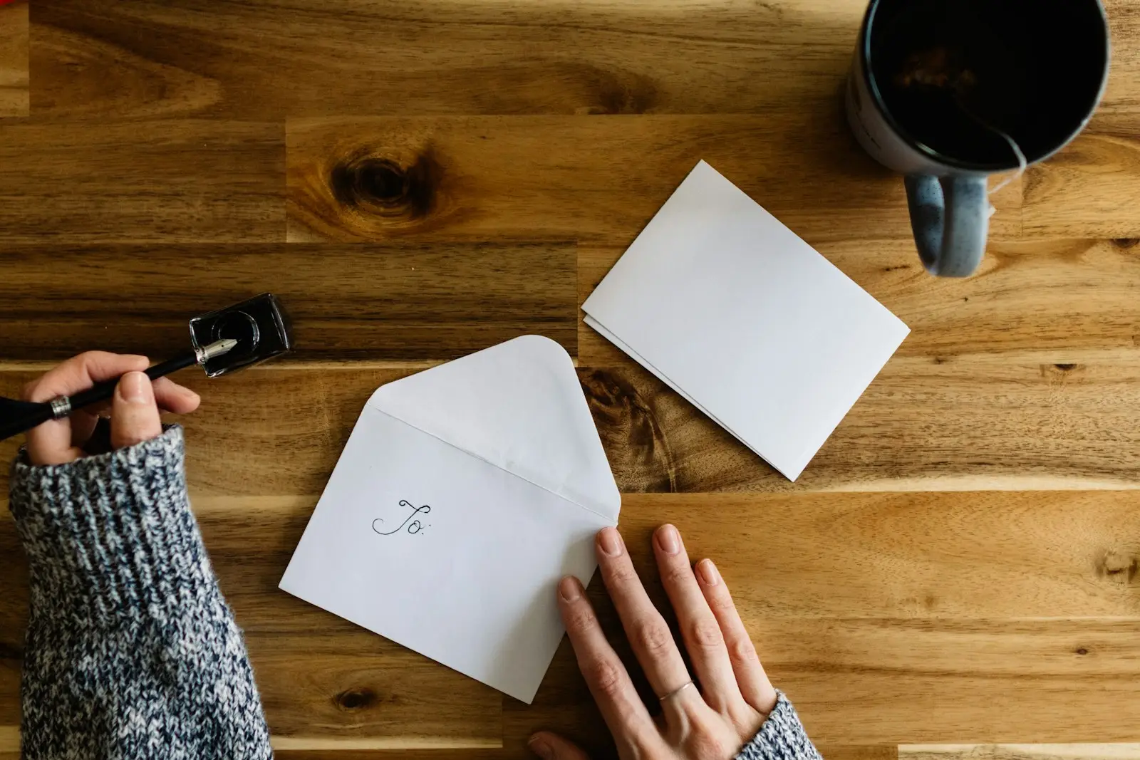 Working through paperwork at a desk with a coffee